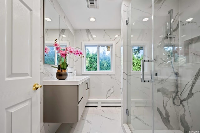 bathroom featuring vanity and a shower with shower door