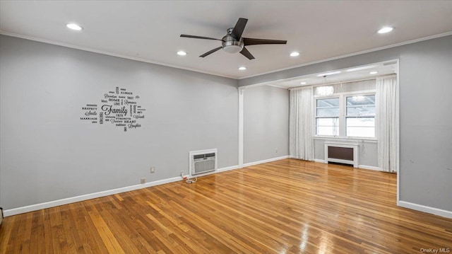 unfurnished room featuring ceiling fan, wood-type flooring, and crown molding