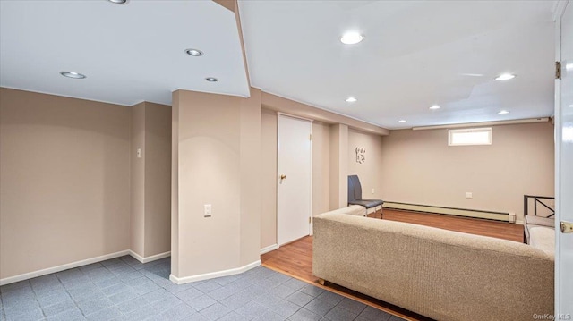 living room with hardwood / wood-style floors and a baseboard radiator