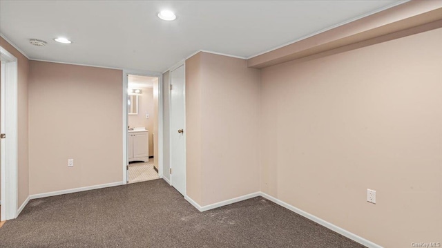 hallway featuring dark colored carpet