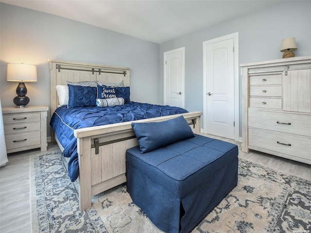 bedroom with light wood-type flooring