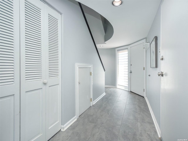 hallway featuring light tile patterned floors