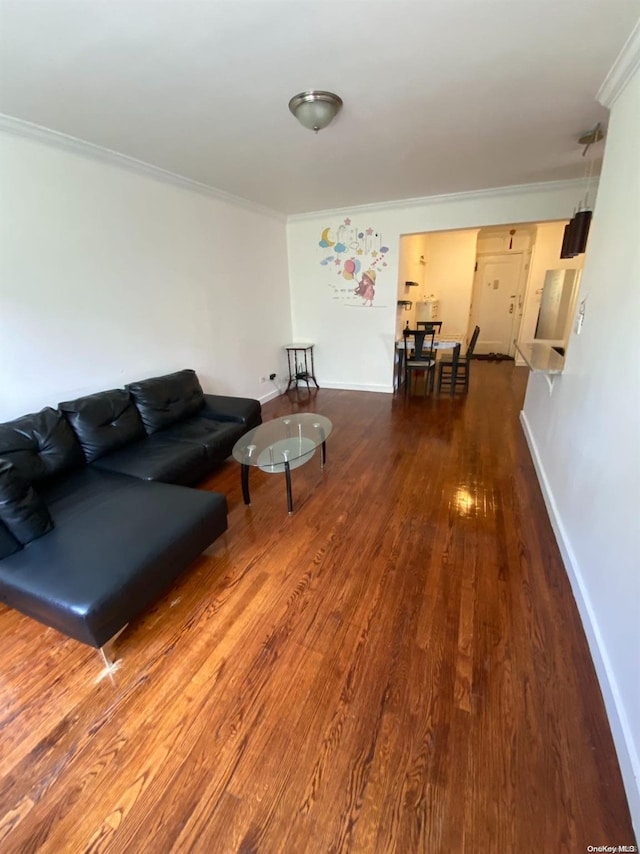 living room featuring hardwood / wood-style floors and ornamental molding