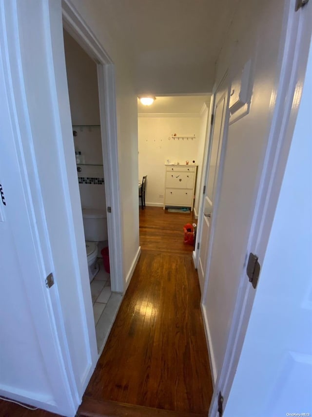 corridor featuring dark hardwood / wood-style floors