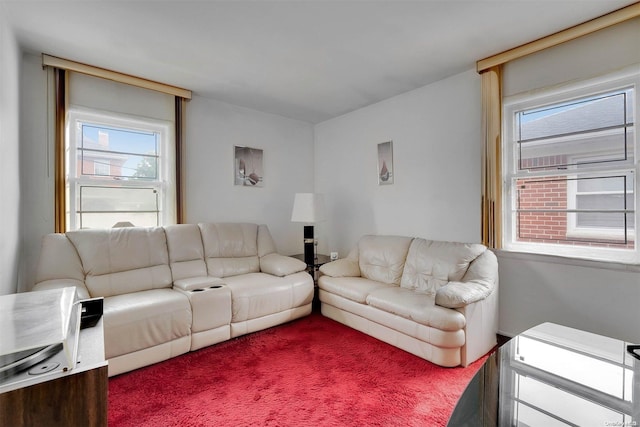 living room with carpet flooring and a healthy amount of sunlight