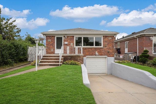 bungalow-style home with a garage and a front lawn