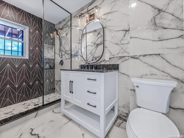 bathroom with tiled shower, toilet, tile walls, and vanity