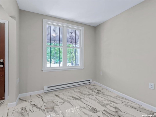 unfurnished room with a baseboard radiator