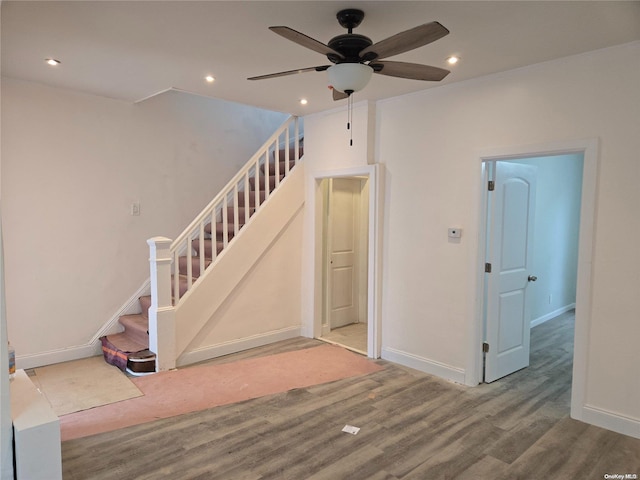 interior space with ceiling fan and wood-type flooring