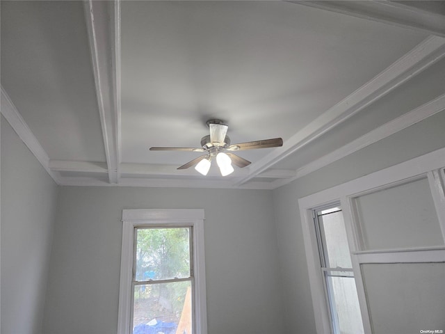 room details with ceiling fan, crown molding, and beamed ceiling