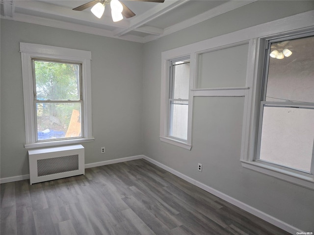 spare room with ceiling fan, radiator heating unit, and hardwood / wood-style floors