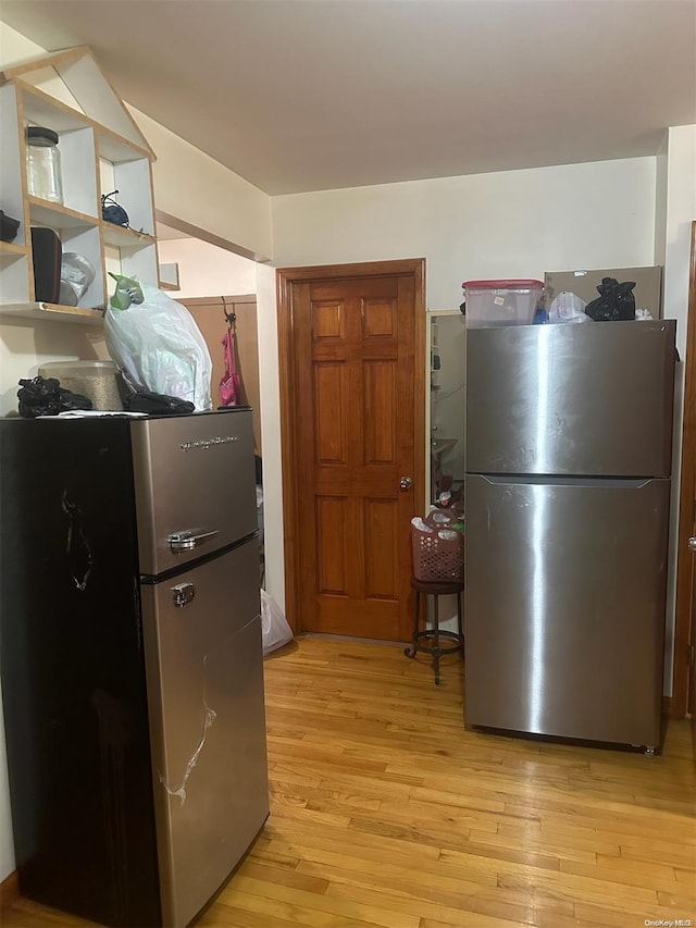 kitchen featuring light hardwood / wood-style floors and stainless steel refrigerator