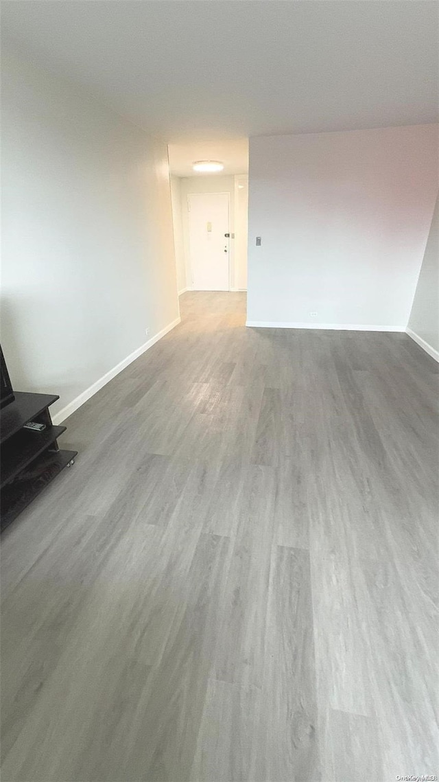 spare room with hardwood / wood-style floors