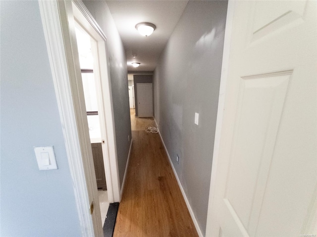 hall with dark hardwood / wood-style floors