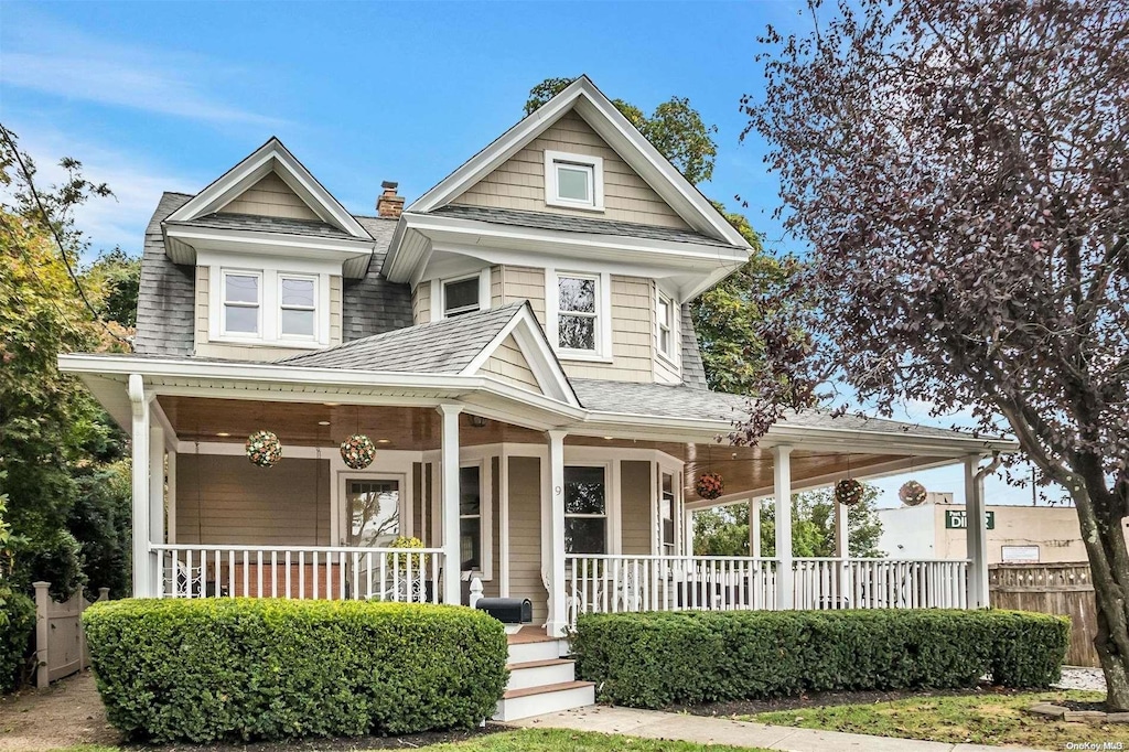 9 N Bayles Ave, Port Washington, NY 11050 - view of front of home with a shingled roof and a porch