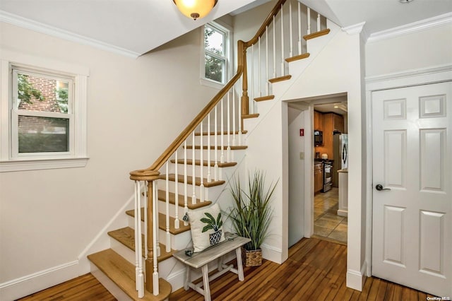 9 N Bayles Ave, Port Washington, NY 11050 - stairs with crown molding, wood finished floors, and baseboards