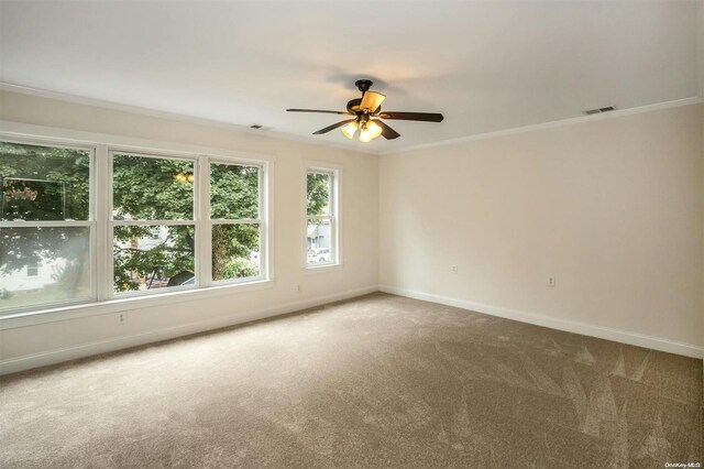 9 N Bayles Ave, Port Washington, NY 11050 - unfurnished room with carpet flooring, baseboards, ceiling fan, and ornamental molding