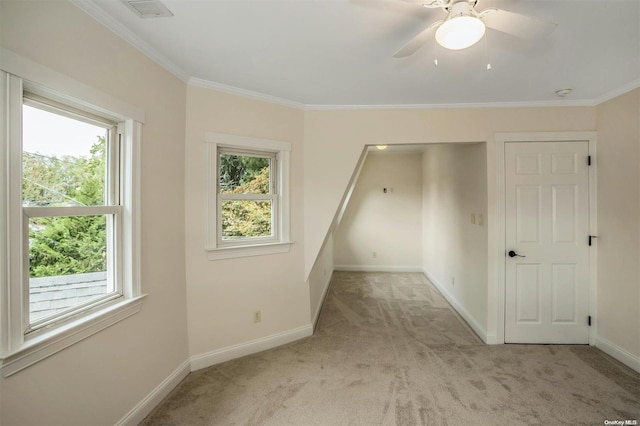 9 N Bayles Ave, Port Washington, NY 11050 - carpeted spare room featuring plenty of natural light, ceiling fan, and crown molding
