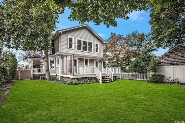9 N Bayles Ave, Port Washington, NY 11050 - rear view of property with a lawn, cooling unit, and a porch
