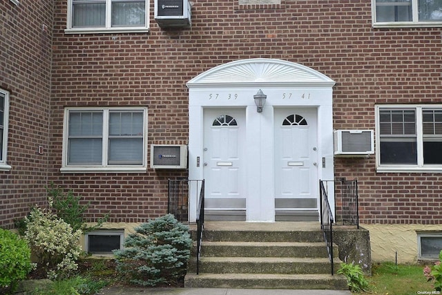 entrance to property with a wall mounted air conditioner