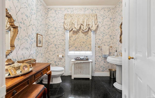 bathroom featuring toilet and ornamental molding