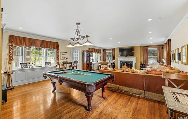 playroom with plenty of natural light and crown molding