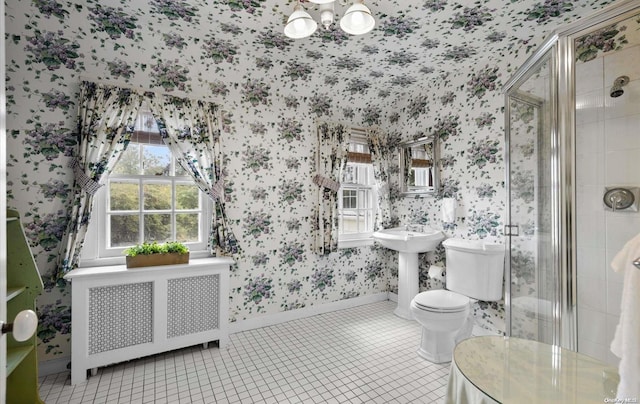 bathroom featuring radiator, sink, walk in shower, tile patterned floors, and toilet