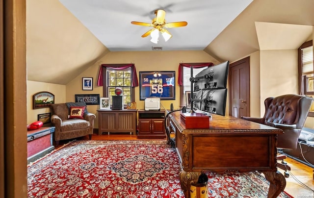 office space featuring ceiling fan, light wood-type flooring, and lofted ceiling