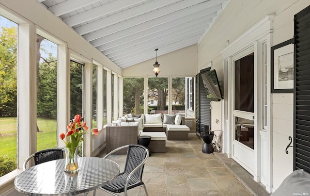 sunroom with lofted ceiling