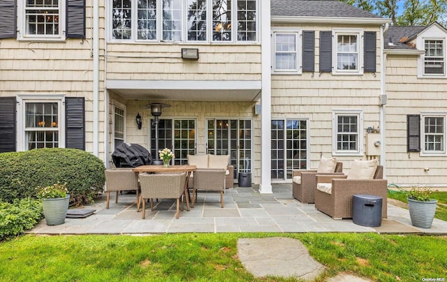 exterior space with an outdoor living space and a patio area