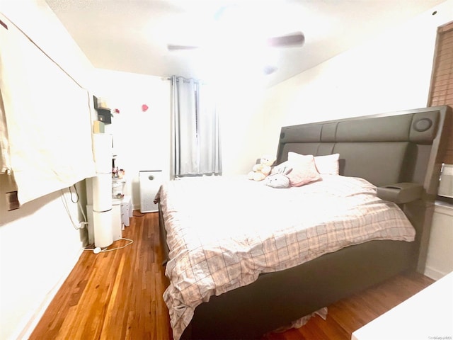 bedroom featuring hardwood / wood-style flooring