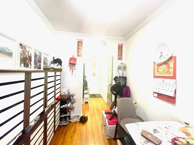 playroom with hardwood / wood-style floors and crown molding