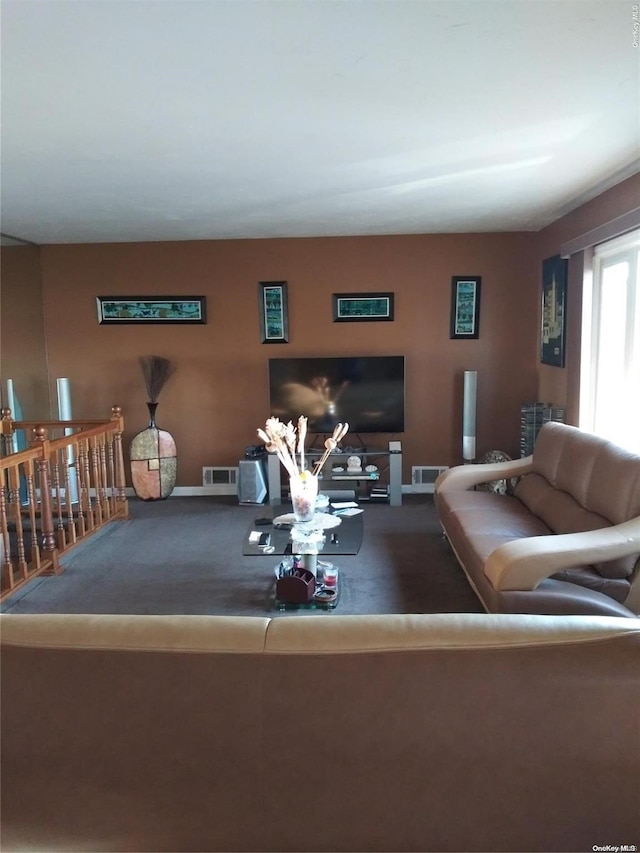 159-29 92nd St, Howard Beach, NY 11414 - living room featuring carpet flooring and baseboards