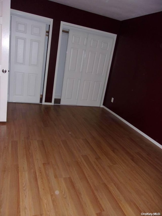 unfurnished bedroom with light hardwood / wood-style floors