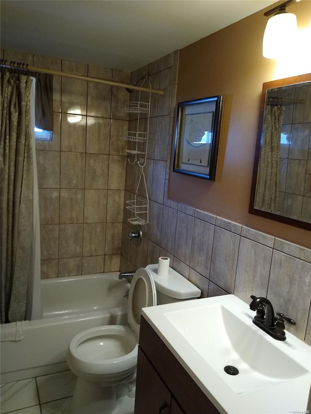 full bathroom featuring vanity, toilet, shower / bathtub combination with curtain, and tile walls