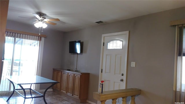 159-29 92nd St, Howard Beach, NY 11414 - foyer entrance featuring a ceiling fan and baseboards