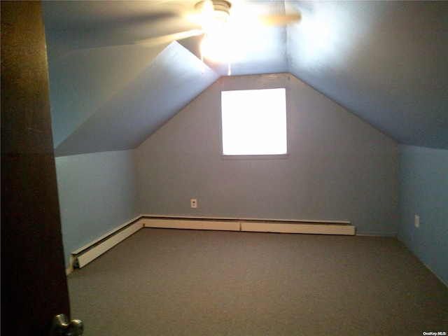 additional living space featuring lofted ceiling, carpet flooring, and ceiling fan