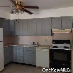 kitchen with white appliances, ceiling fan, sink, light tile patterned floors, and gray cabinets