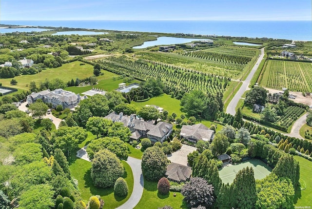 drone / aerial view featuring a rural view and a water view