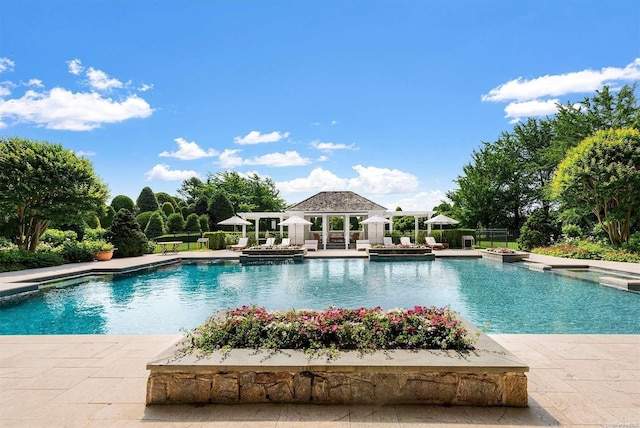 view of swimming pool featuring a gazebo and a patio