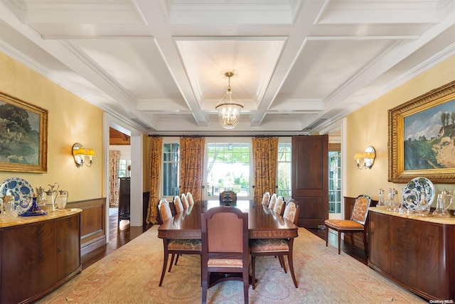 dining space with beamed ceiling, wood-type flooring, and coffered ceiling