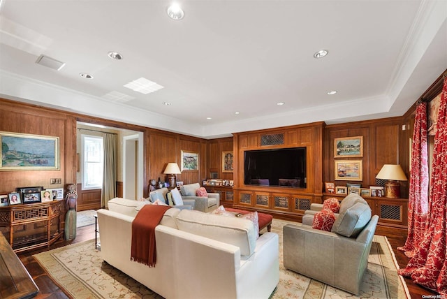 living room with light hardwood / wood-style flooring and ornamental molding