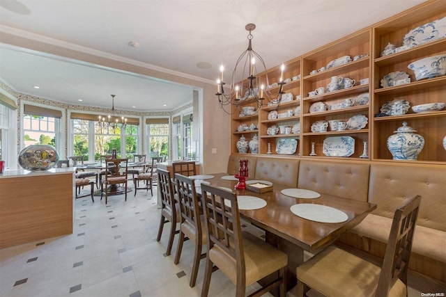 dining room with an inviting chandelier and ornamental molding