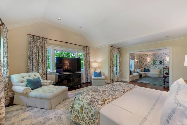 bedroom featuring ornamental molding, lofted ceiling, and hardwood / wood-style flooring