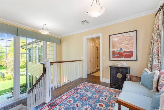 interior space with dark hardwood / wood-style flooring and crown molding