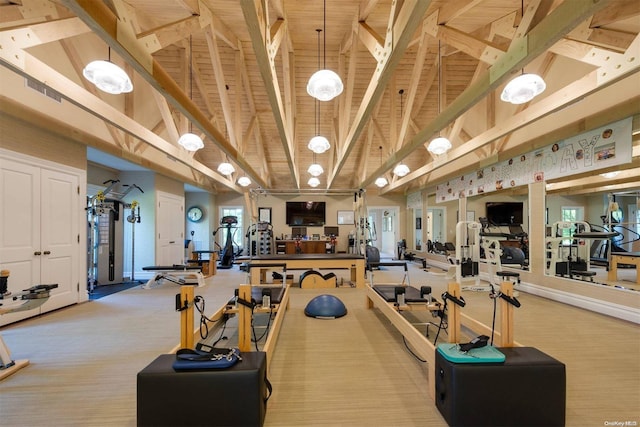 workout area with light carpet, high vaulted ceiling, and wooden ceiling