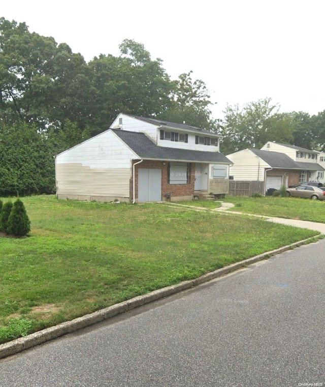 view of front of home with a front lawn