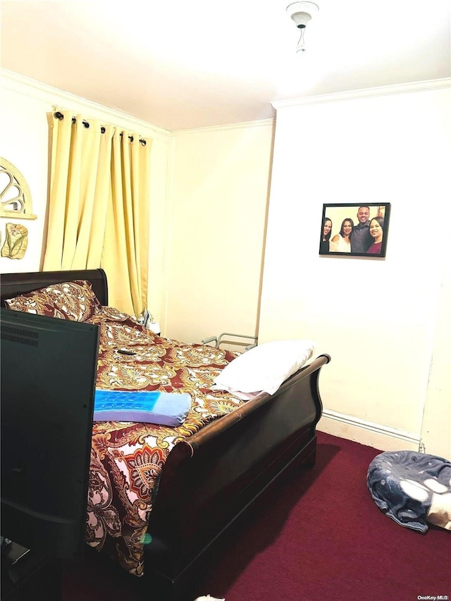 bedroom featuring carpet floors and ornamental molding