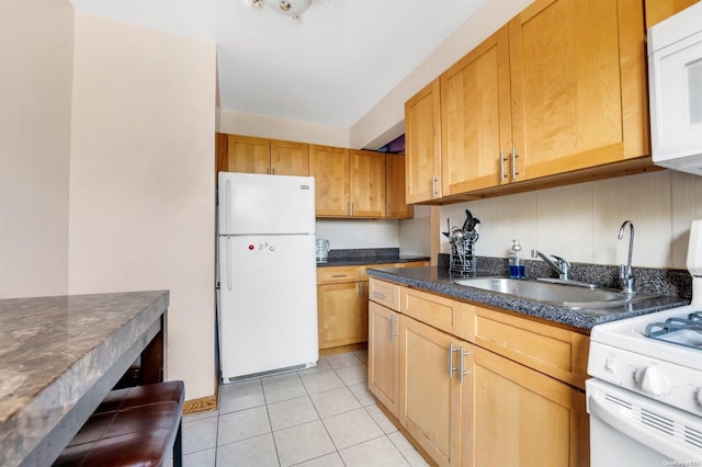 108-50 62nd Dr Unit 3F, Forest Hills, NY 11375 - kitchen featuring white appliances, light tile patterned floors, and dark stone countertops