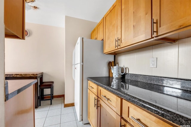 108-50 62nd Dr Unit 3F, Forest Hills, NY 11375 - kitchen featuring light tile patterned floors and freestanding refrigerator